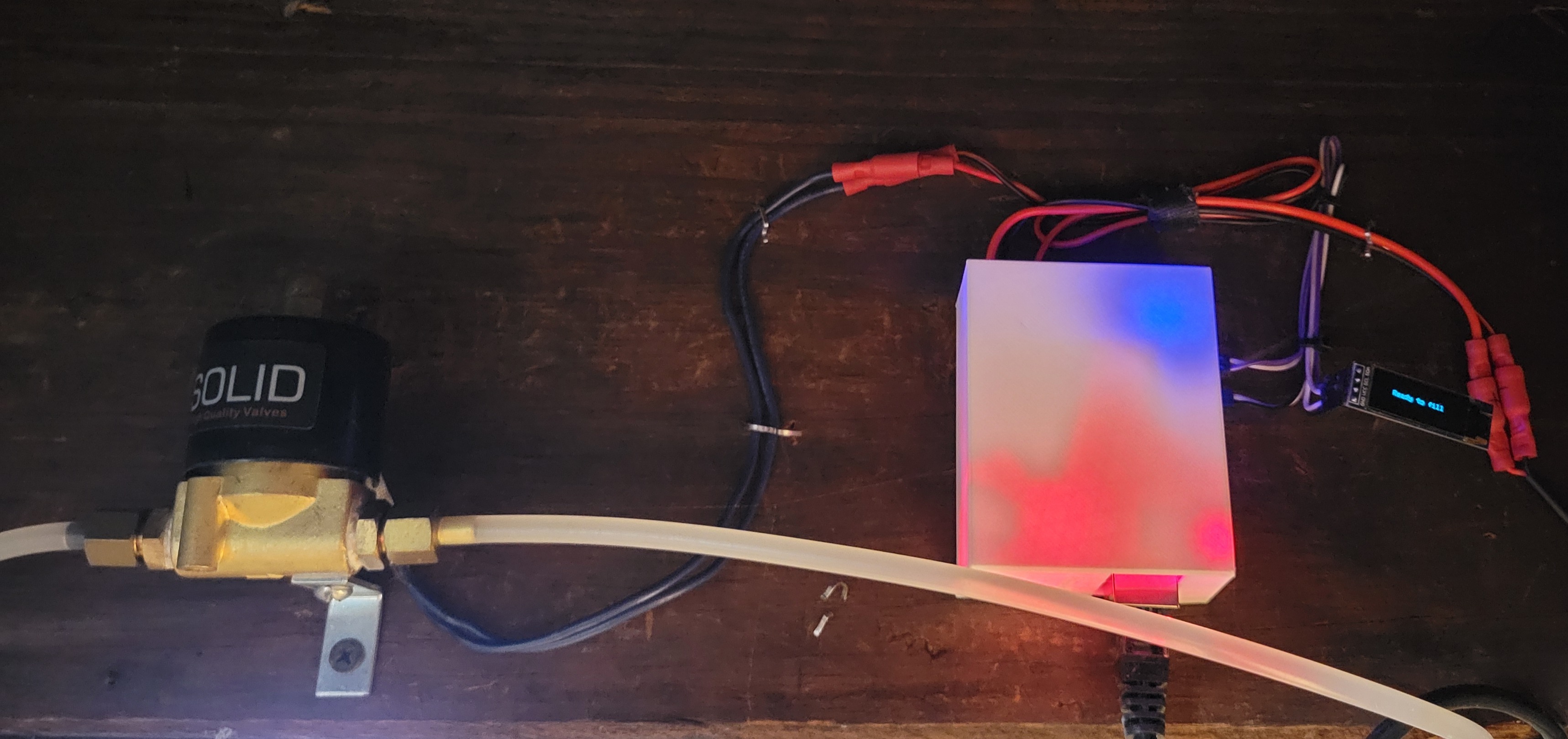 Wider picture showing the 12v switch, the board mounted with cover, and the screen